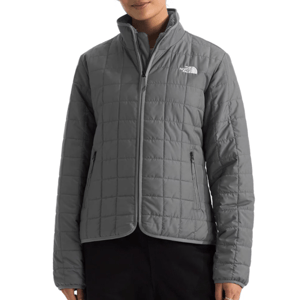 The North Face Junction Jacket is a sleek, quilted jacket in gray featuring a zip-up front, stand collar, and two zippered pockets. The logo is visible on the chest.