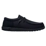 A black slip-on shoe with a textured fabric exterior and a low-profile rubber sole, featuring simple lace detailing.