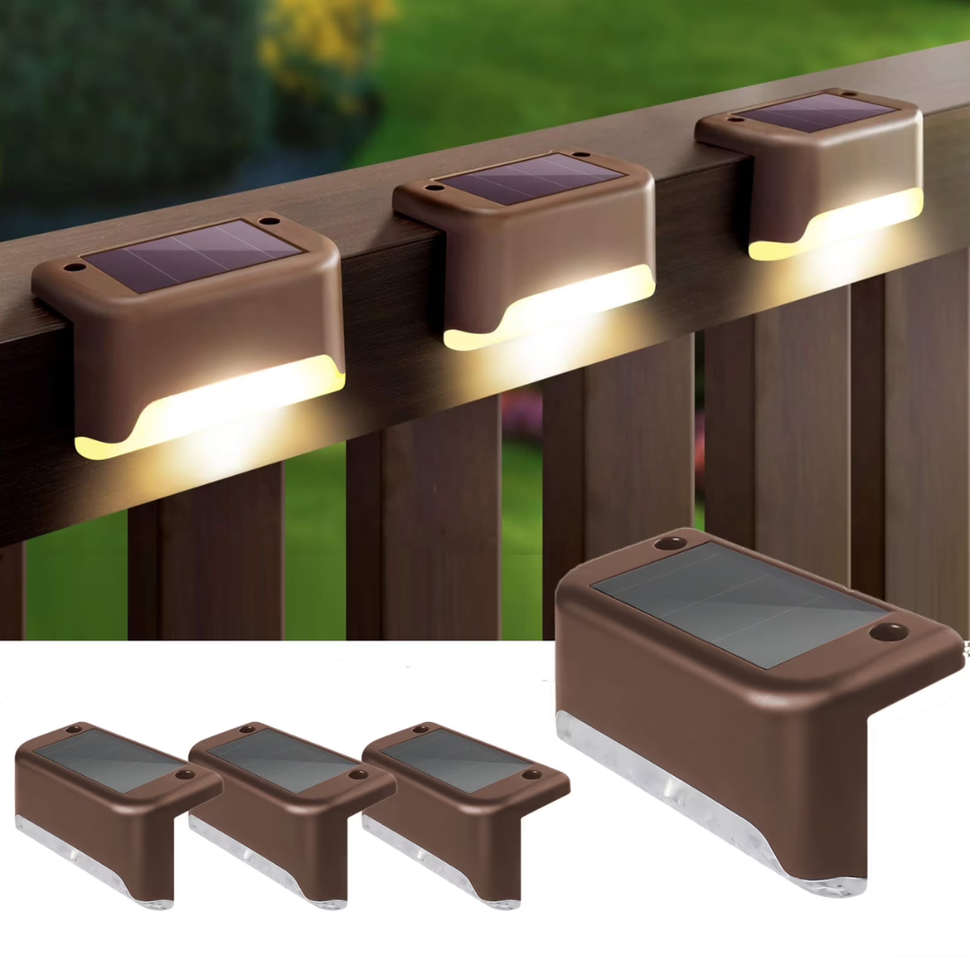 Brown solar-powered deck lights with a compact design are shown installed on a railing, illuminating downward.