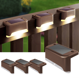 Brown solar-powered deck lights with a compact design are shown installed on a railing, illuminating downward.