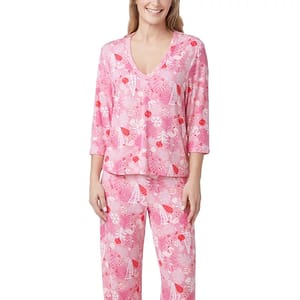 Pink pajama set with a V-neck top and long pants featuring a fun, vibrant pattern of flowers, beach umbrellas, and cocktails, offering a playful and comfortable style.