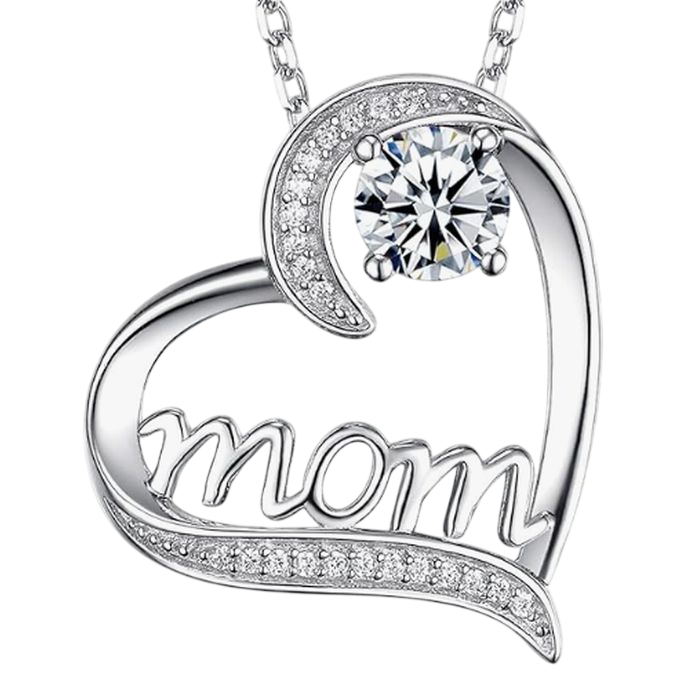 A heart-shaped necklace with the word \“mom\“ features a central large clear gemstone and smaller stones along the edge.