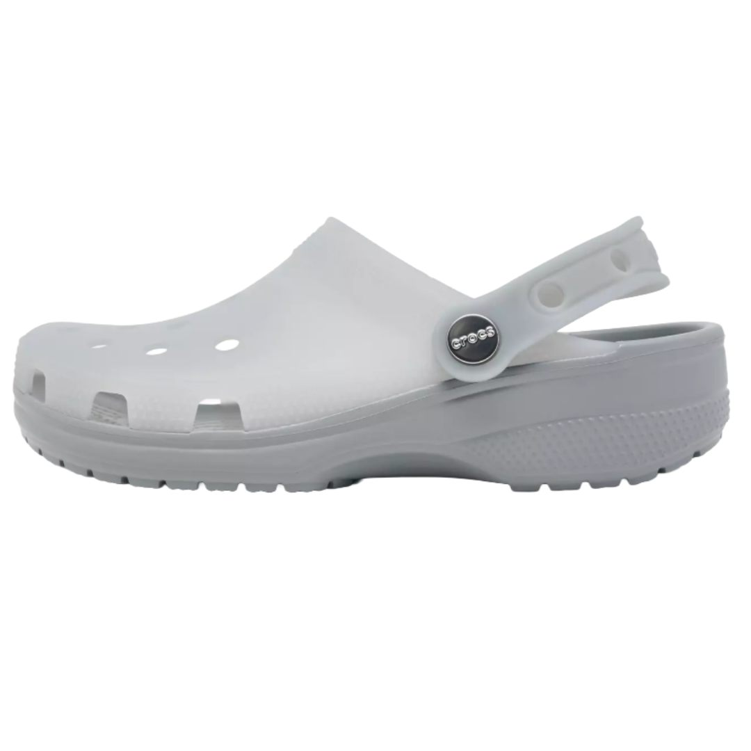 A white Crocs clog with ventilation holes, a pivoting heel strap, and a textured sole for grip.