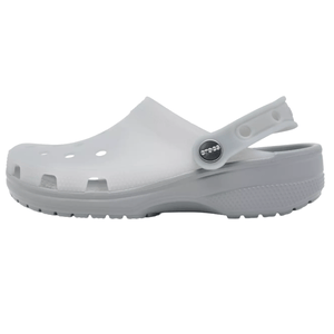 A white Crocs clog with ventilation holes, a pivoting heel strap, and a textured sole for grip.