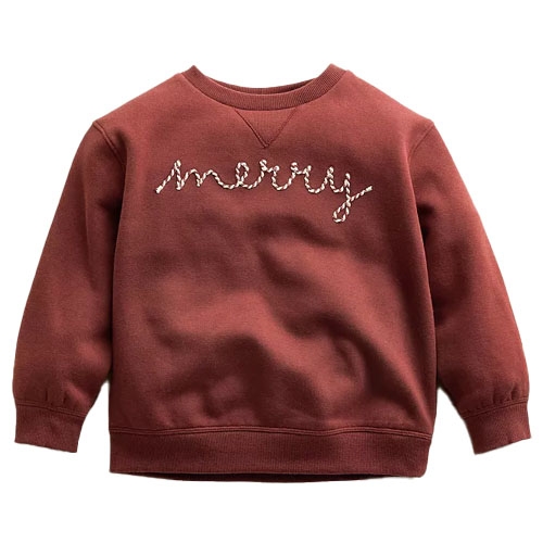 A red-brown sweatshirt featuring the word \“merry\“ in festive script across the chest.