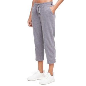 Gray cropped sweatpants with a drawstring waist and side pockets, paired with white sneakers.