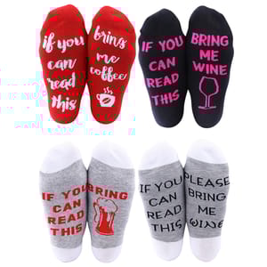 Four pairs of ankle socks with humorous messages: red pair says \“if you can read this, bring me coffee,\“ black pair says \“if you can read this, bring me wine,\“ and two gray pairs say similar messages with beer or wine themes.