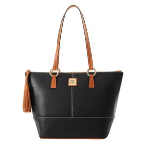 Dooney & Bourke Wexford Leather Tote in black features tan leather handles and trim, a zip closure, and a tassel accent. It has a structured shape with contrast stitching and the Dooney & Bourke logo on a metal plaque.