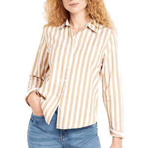 A beige and white vertically striped button-up shirt with long sleeves, paired with blue jeans.