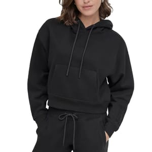 A cropped black DKNY hoodie featuring a spacious front pocket, adjustable drawstrings, and a subtle logo detail on the sleeve.