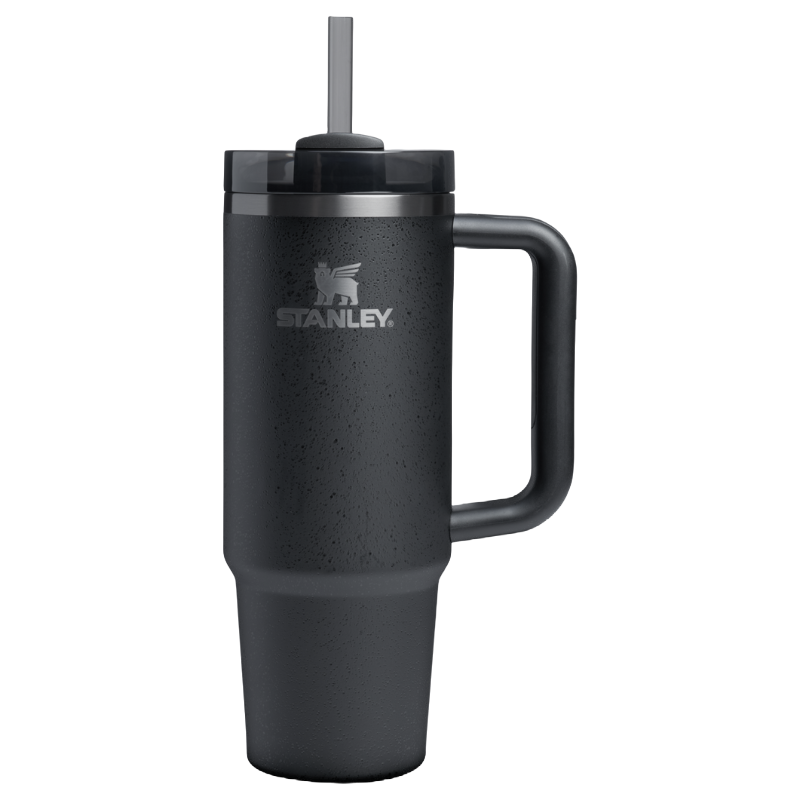 Stanley black insulated tumbler with handle and straw, featuring a logo on its side.