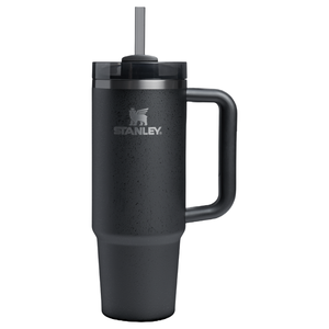 Stanley black insulated tumbler with handle and straw, featuring a logo on its side.