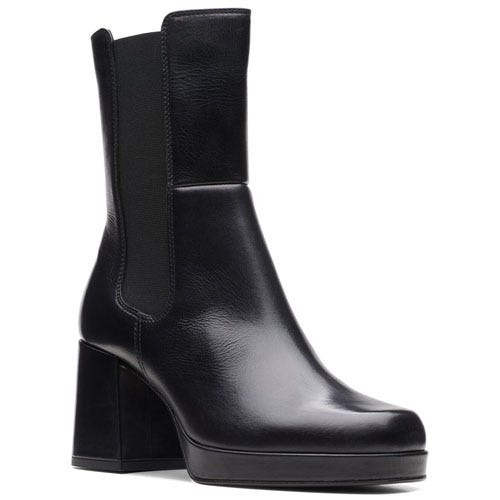 A sleek black leather ankle boot with a block heel and elastic side panels, designed for a stylish and comfortable fit.