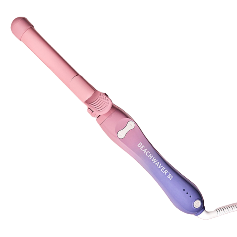 The Beachwaver B-Series curling iron features an automatic rotating barrel and is designed with a pink and purple gradient handle. It facilitates easy styling for creating waves.