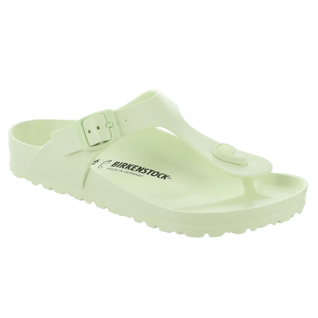 A light green Birkenstock sandal with a thong design, adjustable strap, and the brand's logo on the footbed.