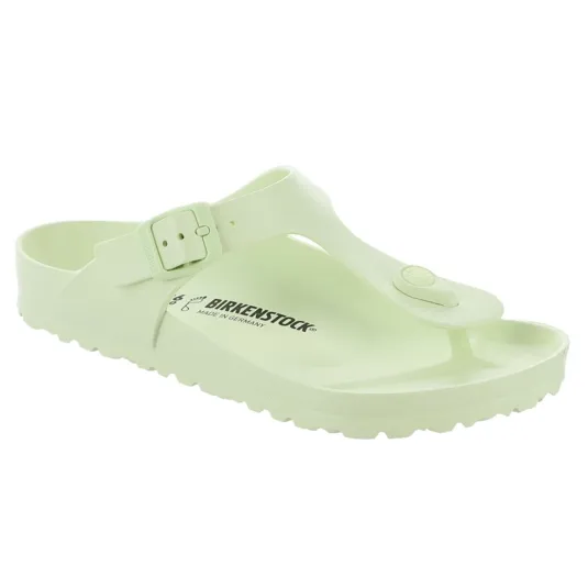 A light green Birkenstock sandal with a thong design, adjustable strap, and the brand's logo on the footbed.