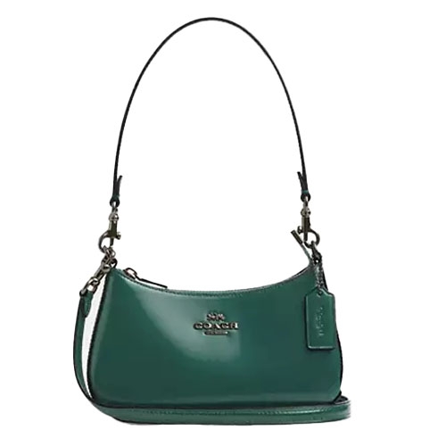 A green leather Coach Outlet shoulder bag with a short strap, featuring a minimalist design with a zippered top and Coach logo on the front.