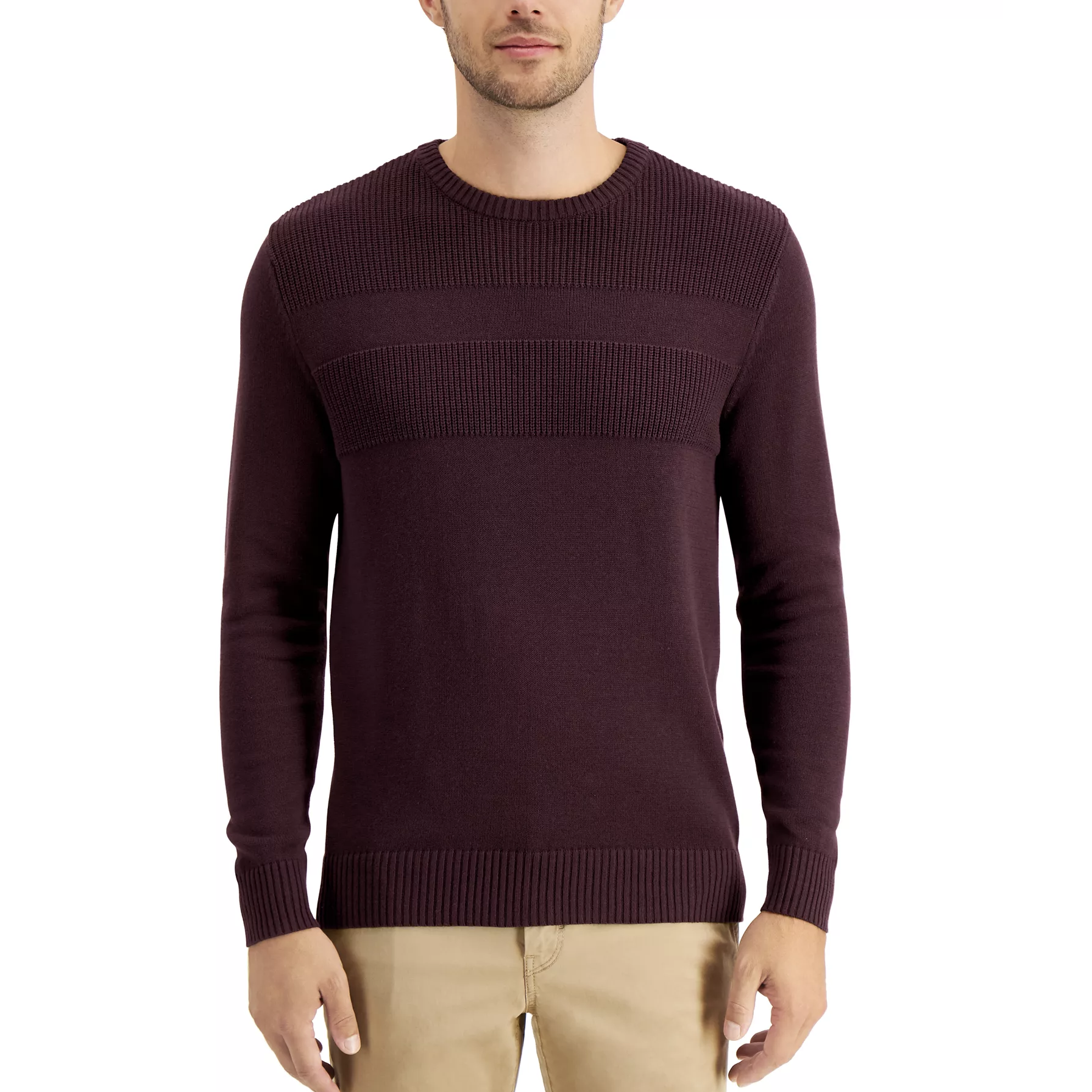 A man is wearing a maroon ribbed sweater with a crew neck and khaki pants.