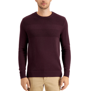 A man is wearing a maroon ribbed sweater with a crew neck and khaki pants.