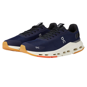 On Men's Cloudnova Form Shoes feature a sleek design with a navy upper, white midsole, and gum rubber outsole. The shoes incorporate cloud cushioning technology for comfort and support, complete with a lace-up closure and minimal branding accents.