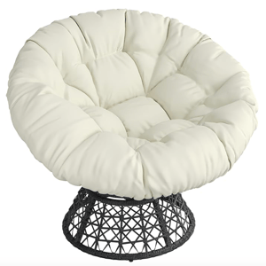 A cream-colored swivel Papasan chair with a round, tufted cushion and a black, woven base.