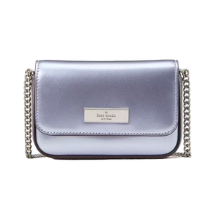 A metallic lavender Kate Spade New York crossbody bag with a chain strap and a front logo plaque.