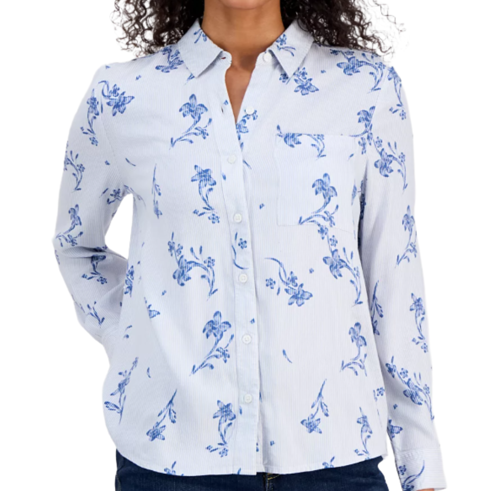 Long-sleeve white shirt with a blue floral print, featuring a button-down front and a single chest pocket.