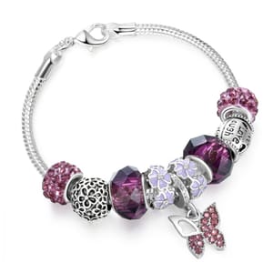 A silver bracelet with a variety of purple and silver charms, including a crystal butterfly pendant, floral designs, and bead accents.