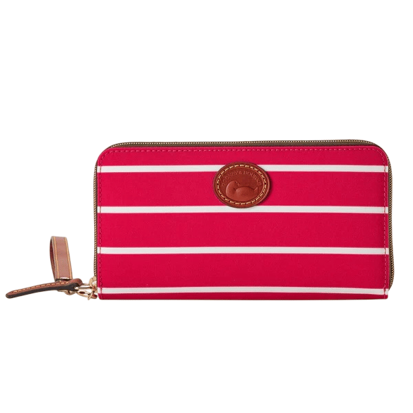 A red and white striped zippered wallet with a leather wrist strap and an embossed round leather logo patch.