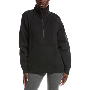 A person is wearing a black half-zip pullover with a kangaroo pocket and gray leggings.