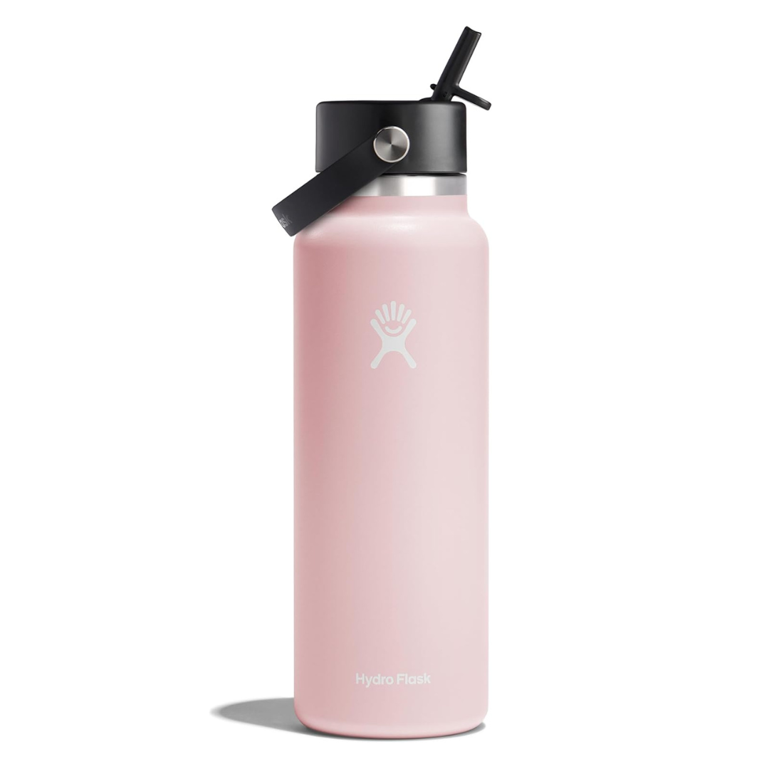 A pink Hydro Flask water bottle with a black lid and straw, featuring the brand's logo.