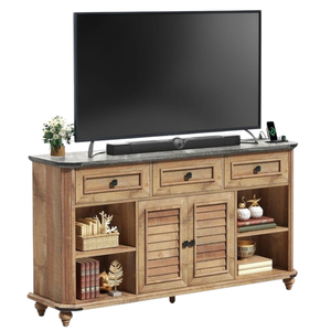 A wooden TV stand features a black flat-screen TV, a soundbar, and decorative items like books, plants, and ornaments on its shelves and drawers.