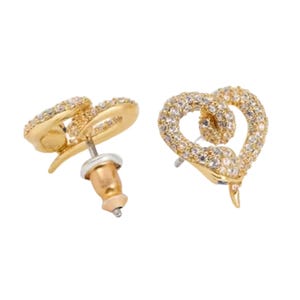 Gold-tone stud earrings shaped like hearts, detailed with an intertwining snake motif and encrusted with small sparkling gems; features a post back closure.