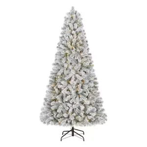 A frosted artificial Christmas tree with a full, conical shape, featuring pre-lit warm white lights and a sturdy metal stand.