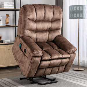A brown, plush recliner chair with a lift function, featuring a side pocket and remote control, set in a living room with a floor lamp and bookshelf in the background.