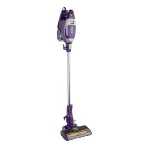 A purple and silver cordless Shark vacuum cleaner with a detachable handheld unit and a wide floor nozzle.