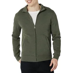 A person is wearing an olive green, full-zip jacket over a white shirt with black pants. The jacket features a high collar and two front pockets.