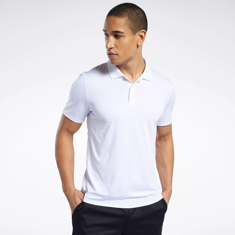 Man wearing a white polo shirt and black pants.