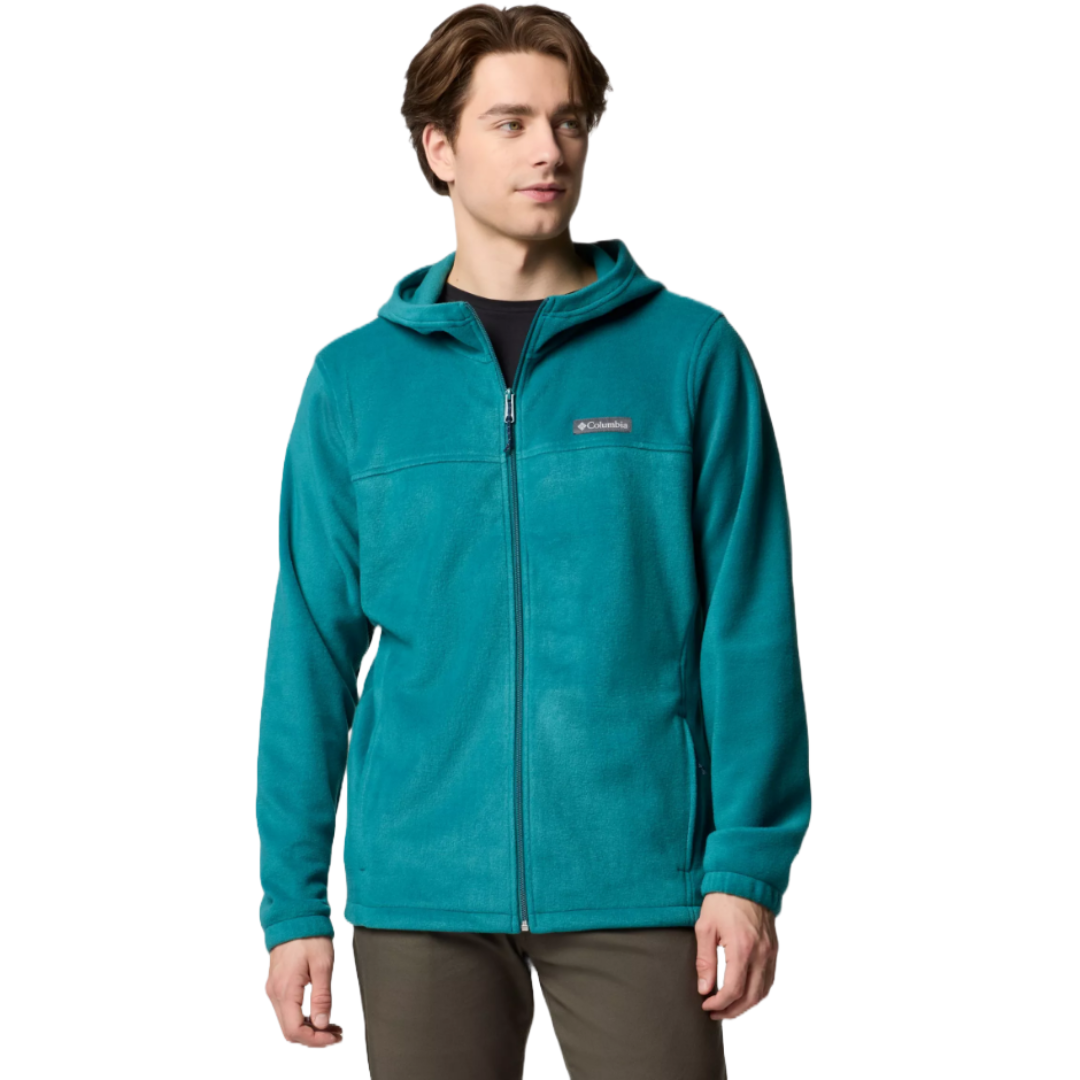 A person is wearing a teal Columbia fleece jacket with a hood, front zipper, and two pockets.