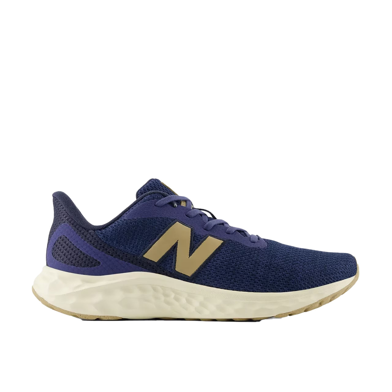 New Balance Fresh Foam Arishi shoes in navy blue feature a gold \“N\“ logo, mesh upper for breathability, and a cushioned white sole for comfort and support.