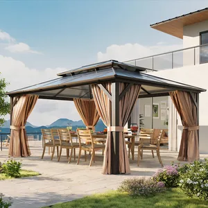 A patio gazebo with a metal roof and beige curtains, featuring a dining table set with wooden chairs, situated on a stone terrace with mountain views.