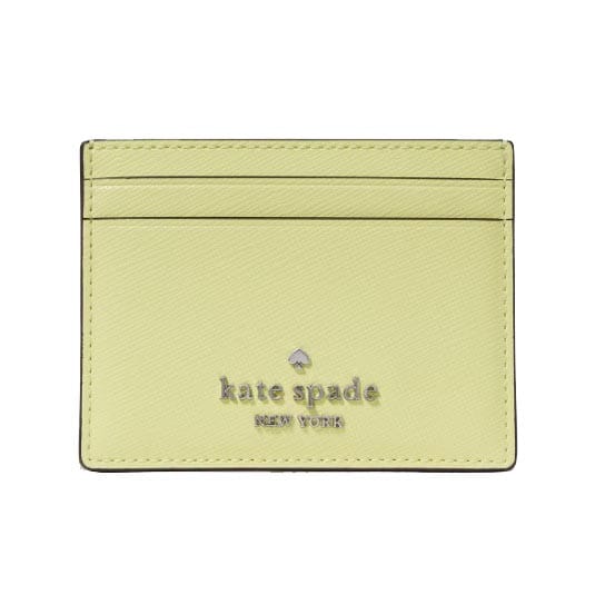 A light green Kate Spade cardholder with multiple slots and the brand's logo on the front.