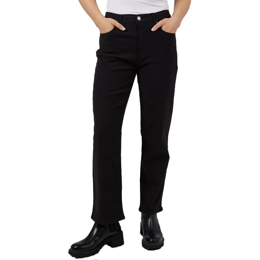Black straight-leg jeans with a high-rise waist, featuring front and back pockets, and paired with chunky black ankle boots.