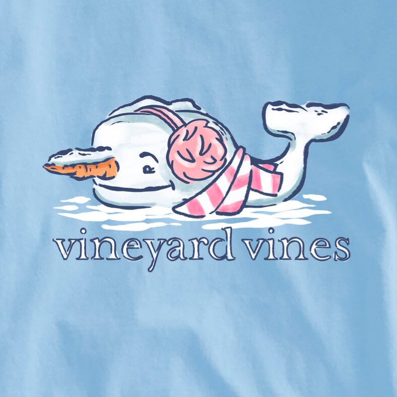 Blue graphic featuring a whale with a carrot nose, earmuffs, and a striped scarf, alongside the text \“vineyard vines.\“