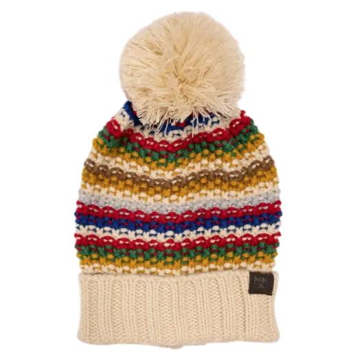 A colorful, striped knitted beanie with a large pom-pom on top, featuring a ribbed, cream-colored cuff and a metal tag label.