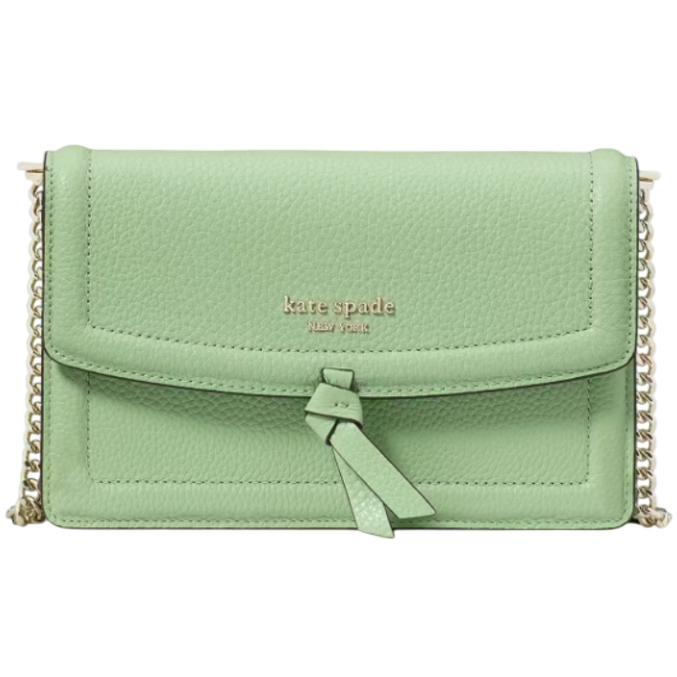 A mint green Kate Spade leather flap crossbody bag with gold-tone chain strap and hardware, featuring a tassel detail and embossed logo on the front.