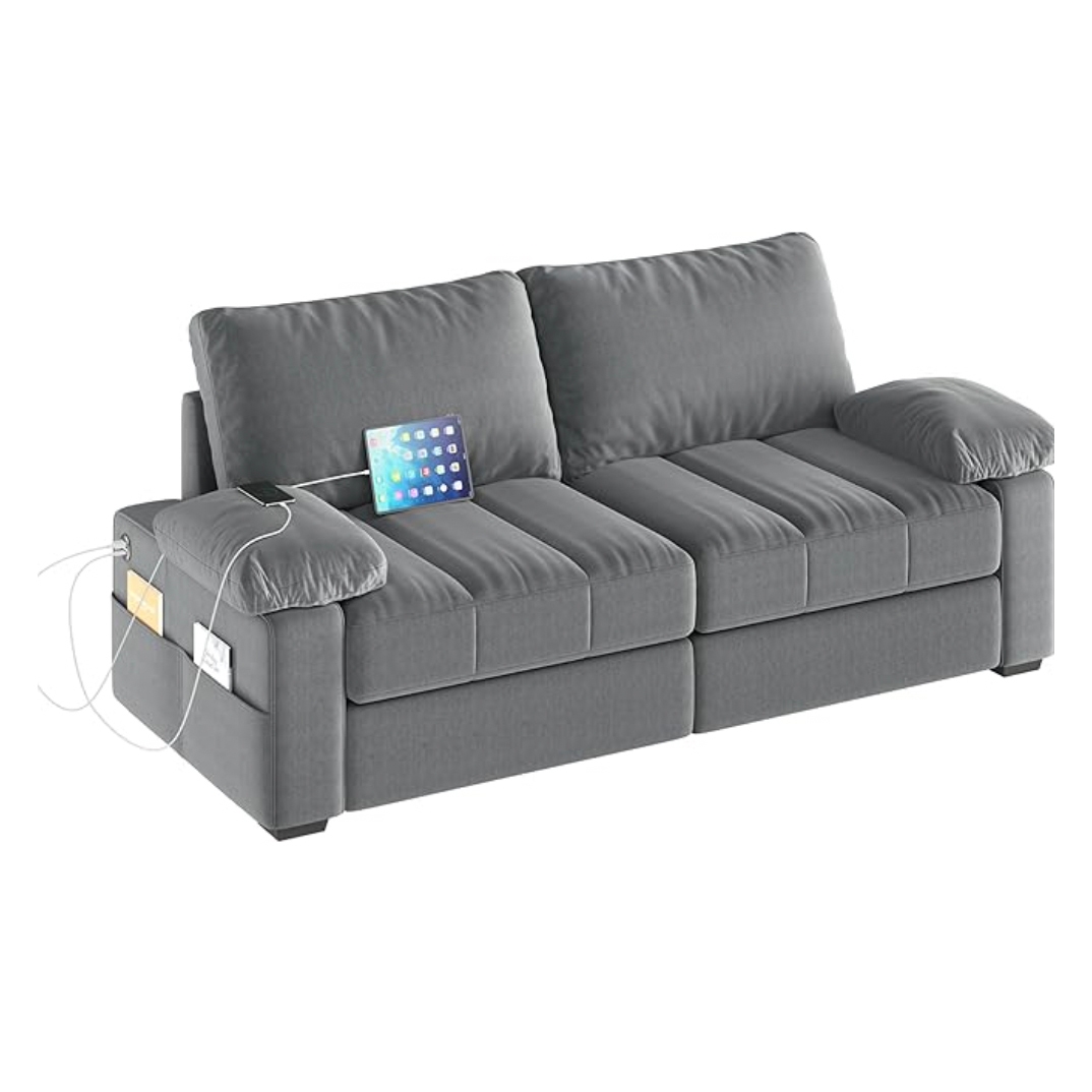 A gray three-seater sofa with built-in USB ports and a matching pillow, with an iPad resting on the armrest.