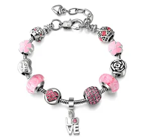 A charm bracelet featuring pink beads, floral designs, and a \“LOVE\“ pendant, with elements of silver and pink accents.