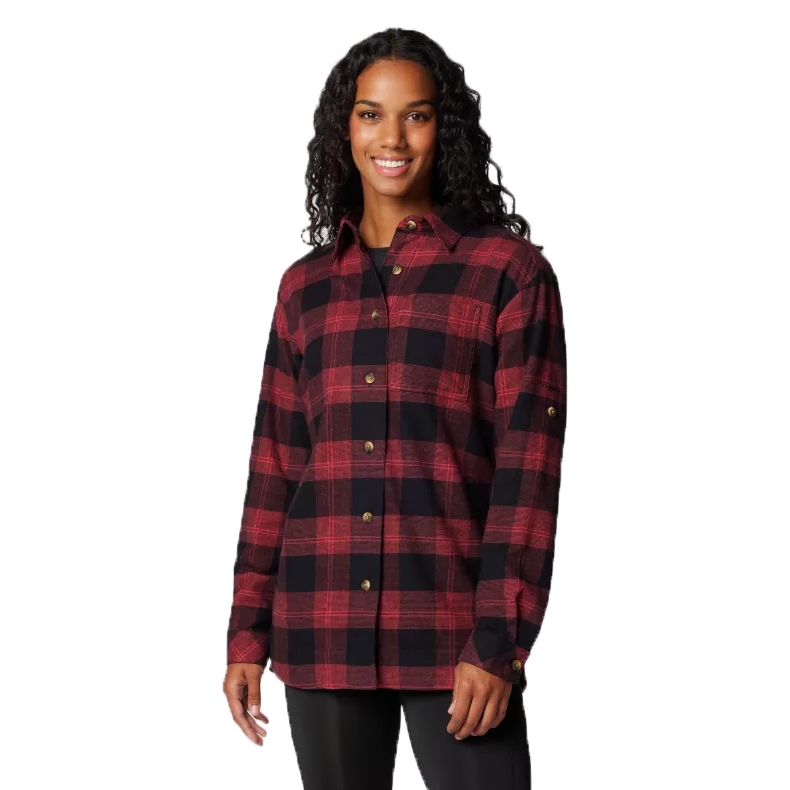 Columbia Women's Flannel features a black and red plaid pattern with long sleeves and button closures, designed for a comfortable and casual fit.