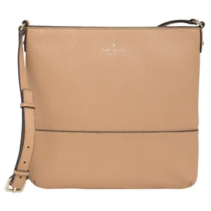 A beige leather crossbody bag with a pebbled texture, featuring the brand \“kate spade\“ embossed on the front in small lettering, and an adjustable strap with gold-tone hardware.